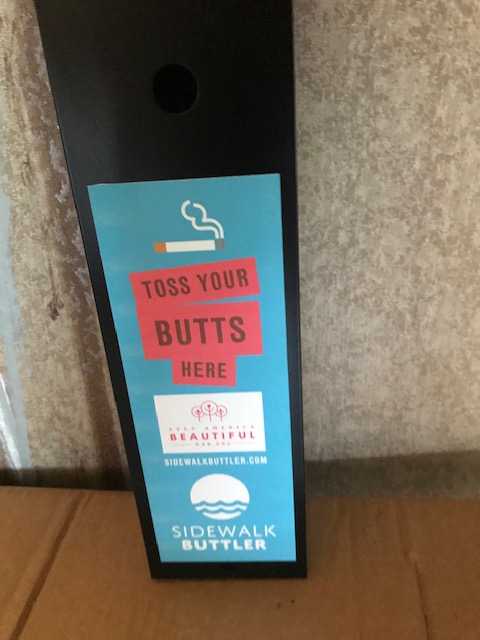 Sidewalk Buttler receptacle labelled Toss Your Butts Here